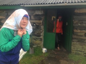 Claire Maxted, Editor of Trail Running Magazine models a personalised SplashMap at a Bothy in Scotland