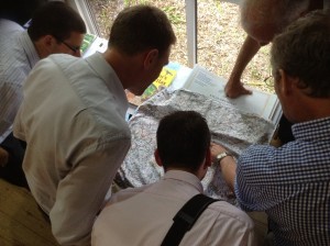 Cartographers pour over the maps at the British Cartographic Society conference in June